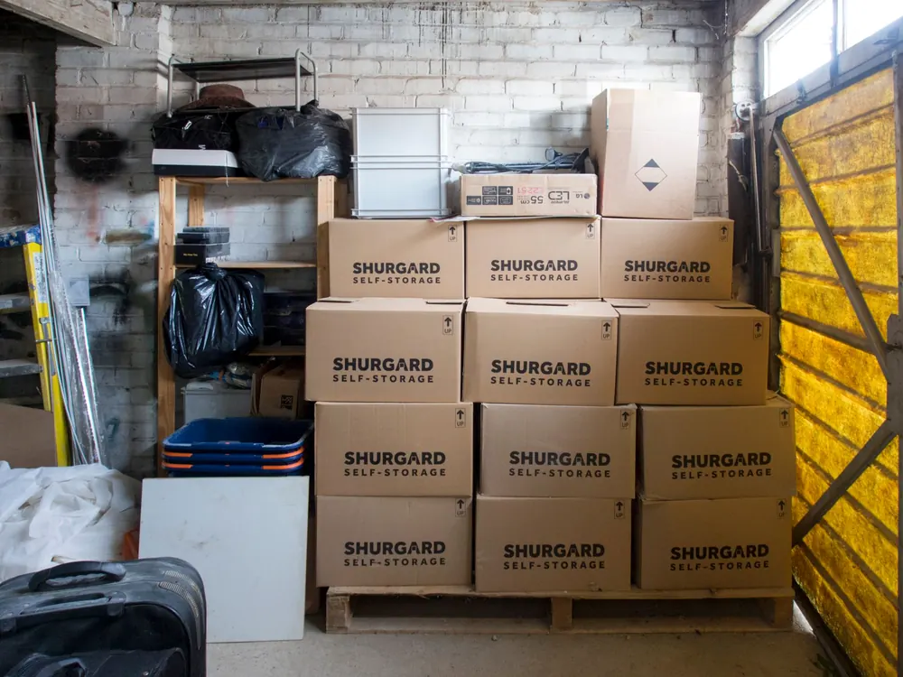 Sealed cartons stacked on racking in a clean storage unit